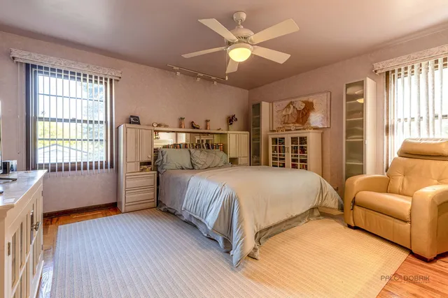 a bedroom with a large bed and a couch