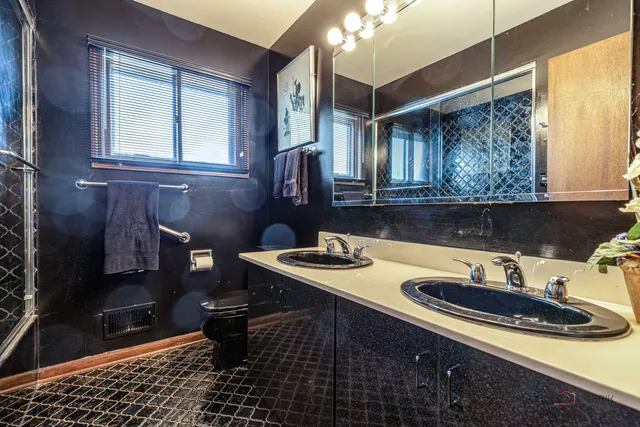 a bathroom with a sink a vanity and a mirror