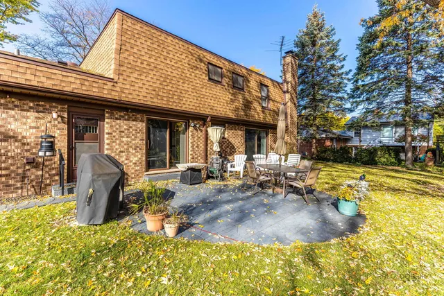 a view of a swimming pool with sitting area and furniture