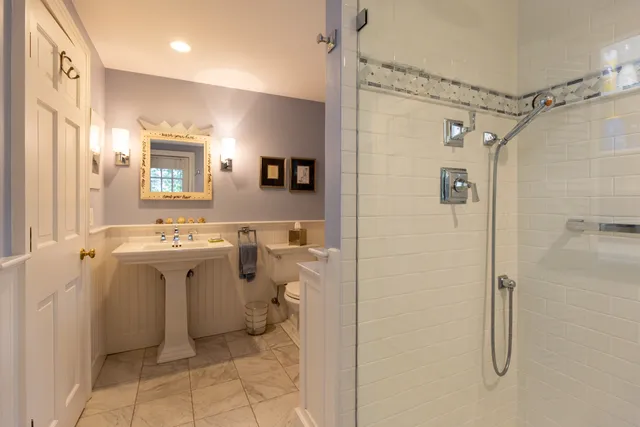 a view of a bathroom with a sink toilet and shower