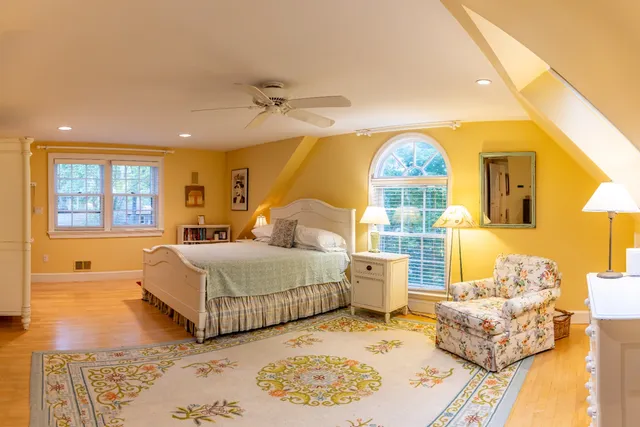 a bedroom with bed and a window