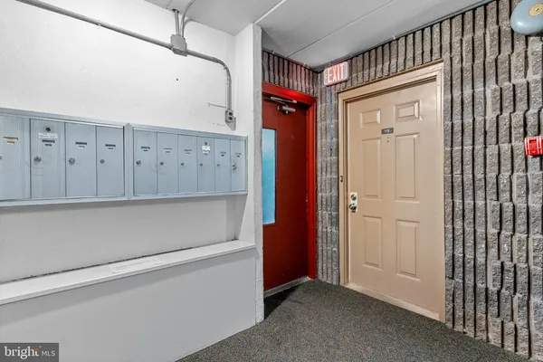 a view of a utility room with closet and windows