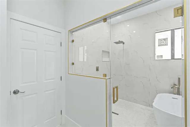 a bathroom with a shower and toilet