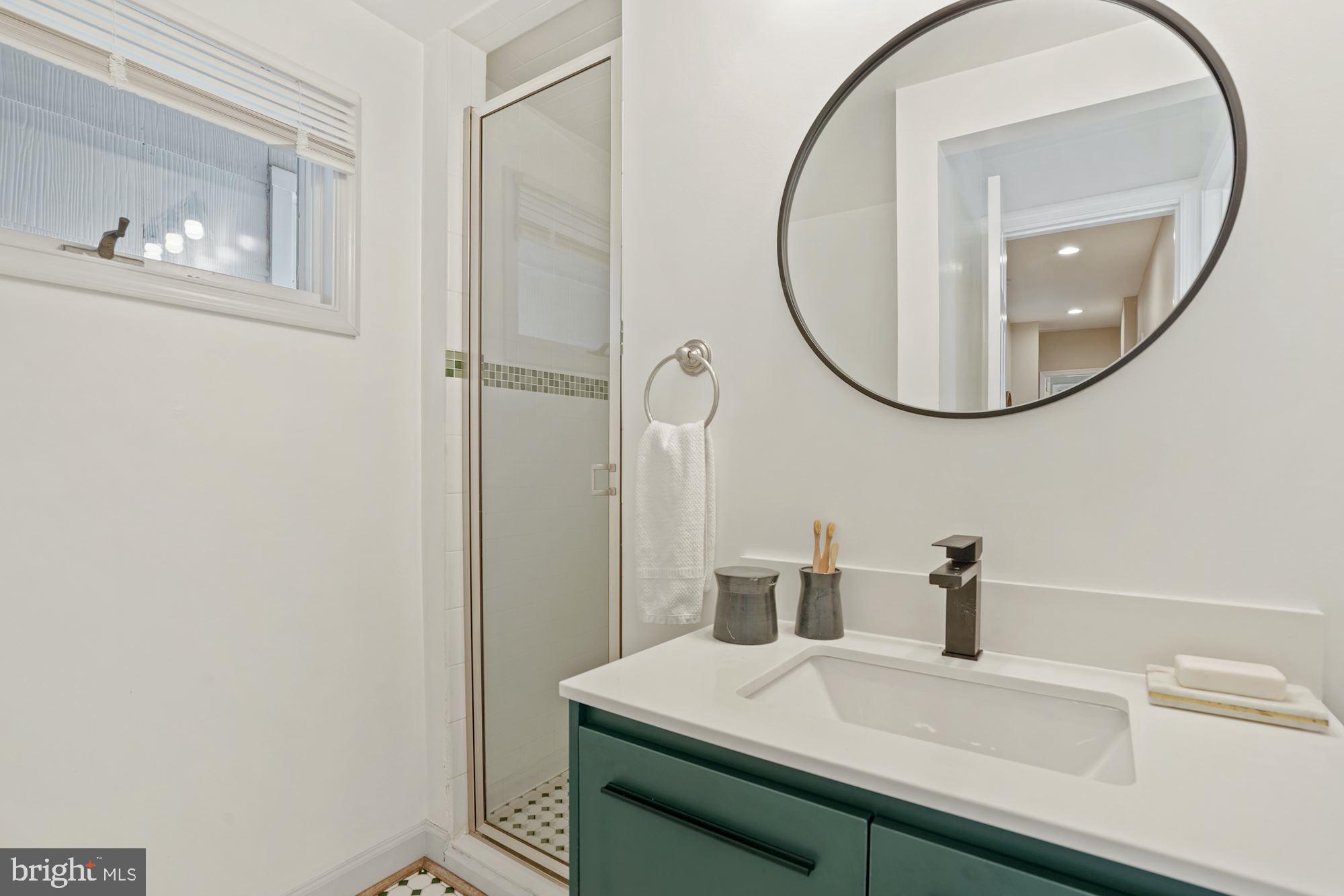 2411 Observatory Place Northwest Washington, DC 20007 - Photo 30 of 45 3rd full bath with new vanity, lights and mirror