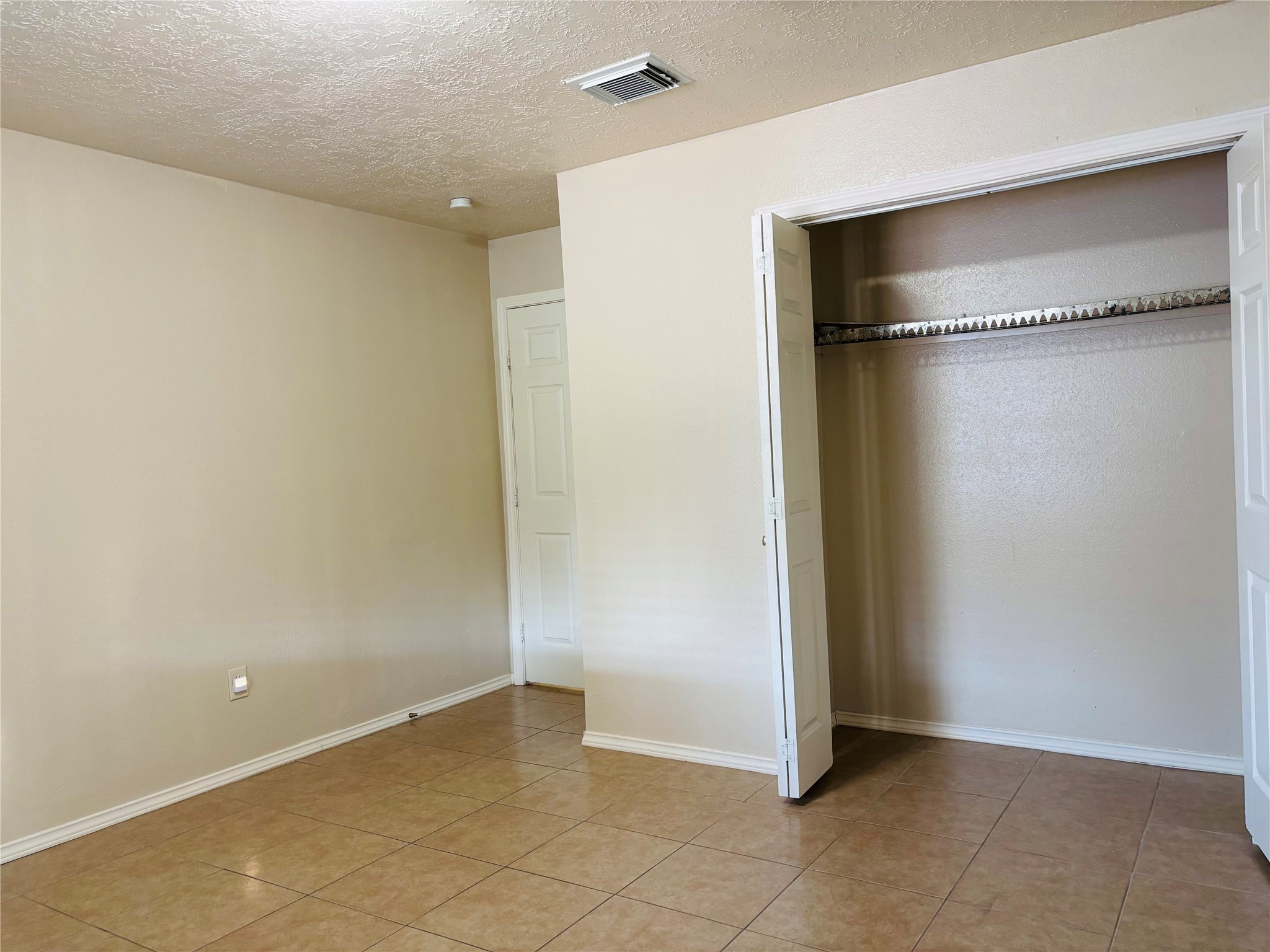 12409 Sharpview Drive, Unit 2409 Houston, TX 77072 - Photo 16 of 21 a view of an empty room