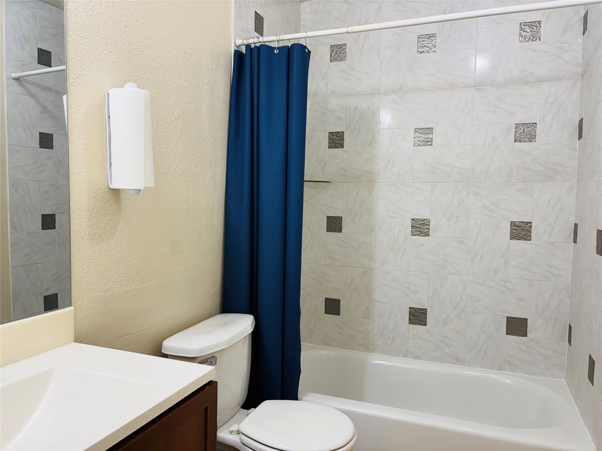 12409 Sharpview Drive, Unit 2409 Houston, TX 77072 - Photo 18 of 21 a bathroom with a sink a toilet and shower