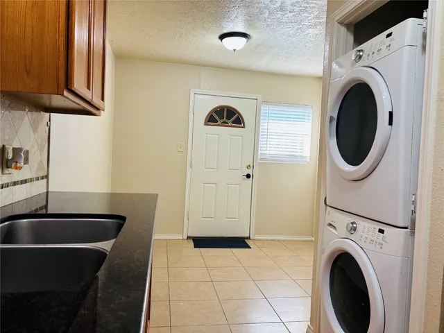 a view of a kitchen with washer and dryer