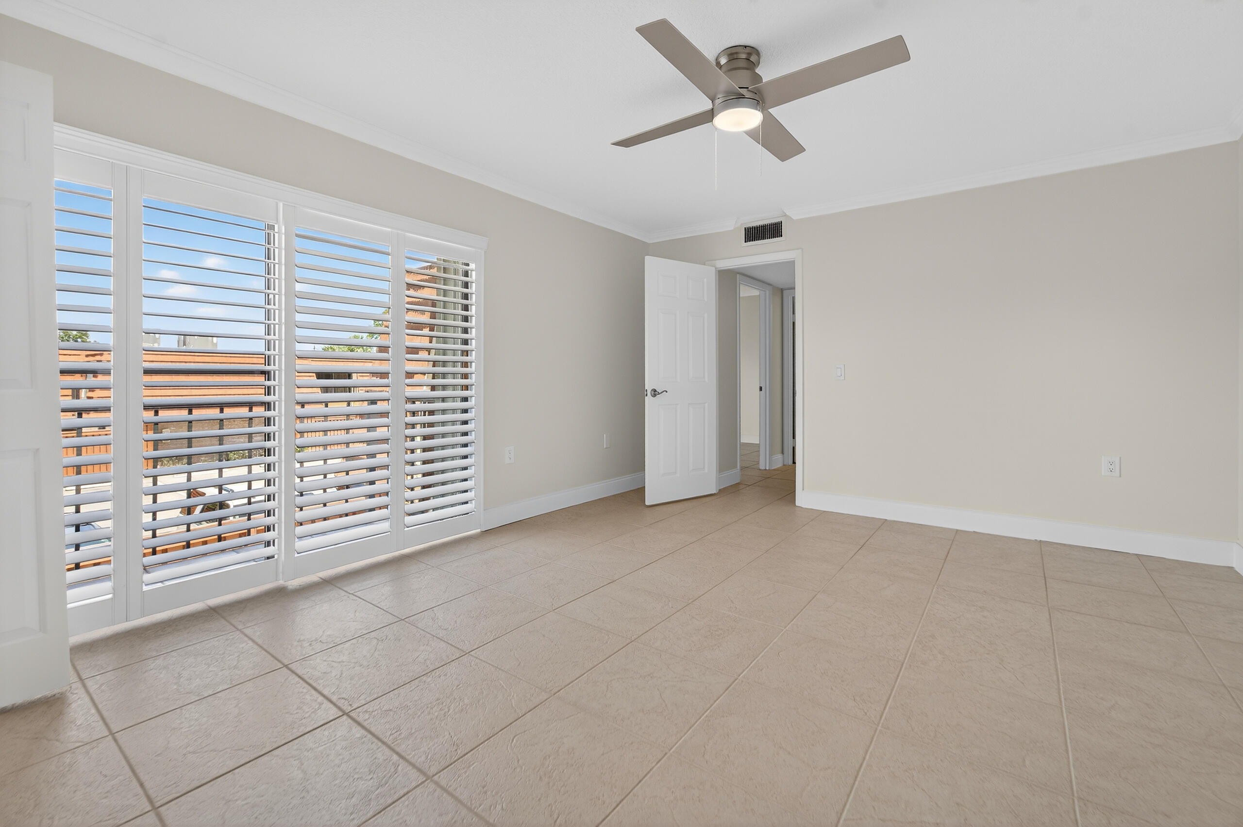 3900 County Line Road, Unit 11D Tequesta, FL 33469 - Photo 18 of 53 a view of an empty room with a window