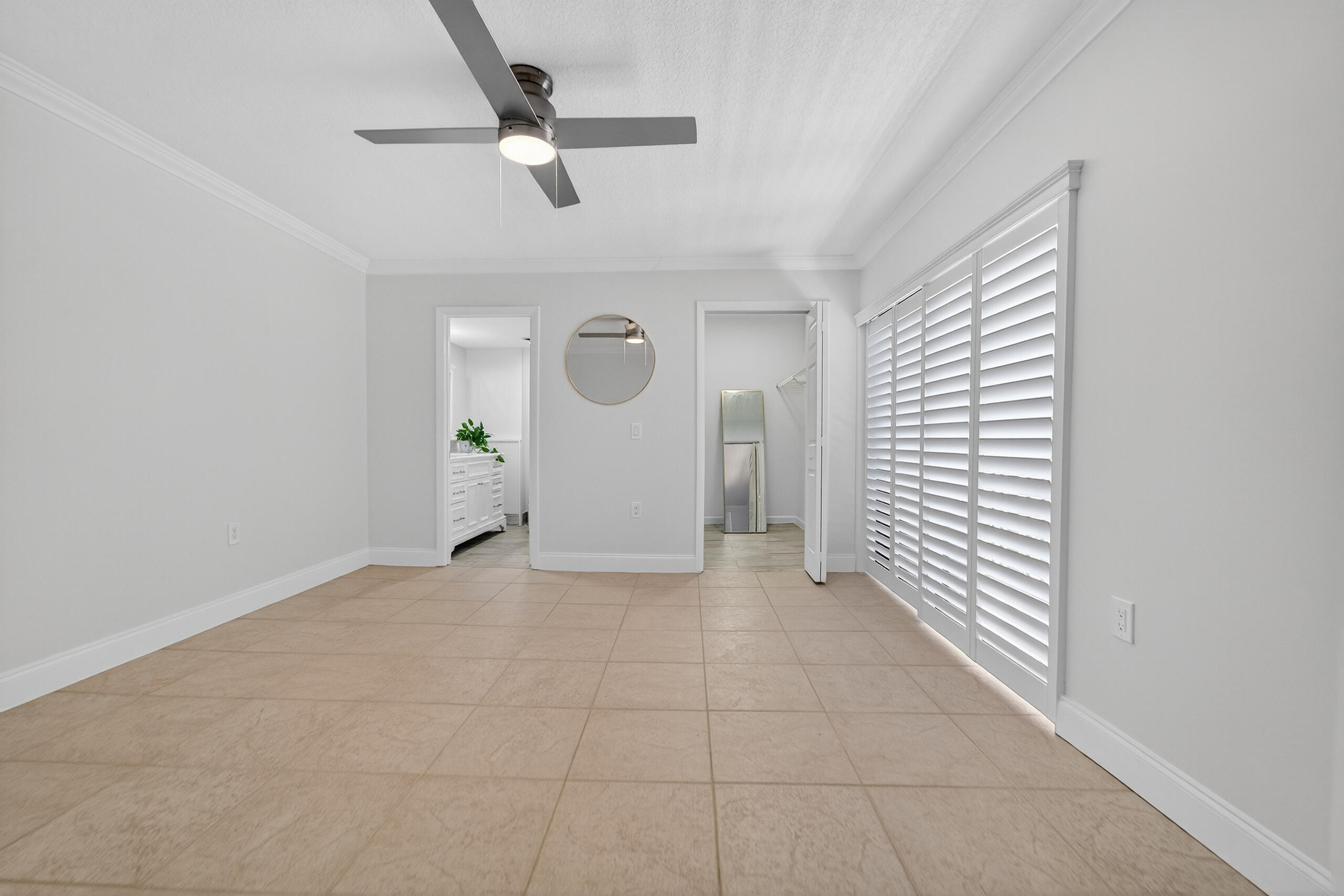 3900 County Line Road, Unit 11D Tequesta, FL 33469 - Photo 19 of 53 a view of a livingroom with a ceiling fan and window