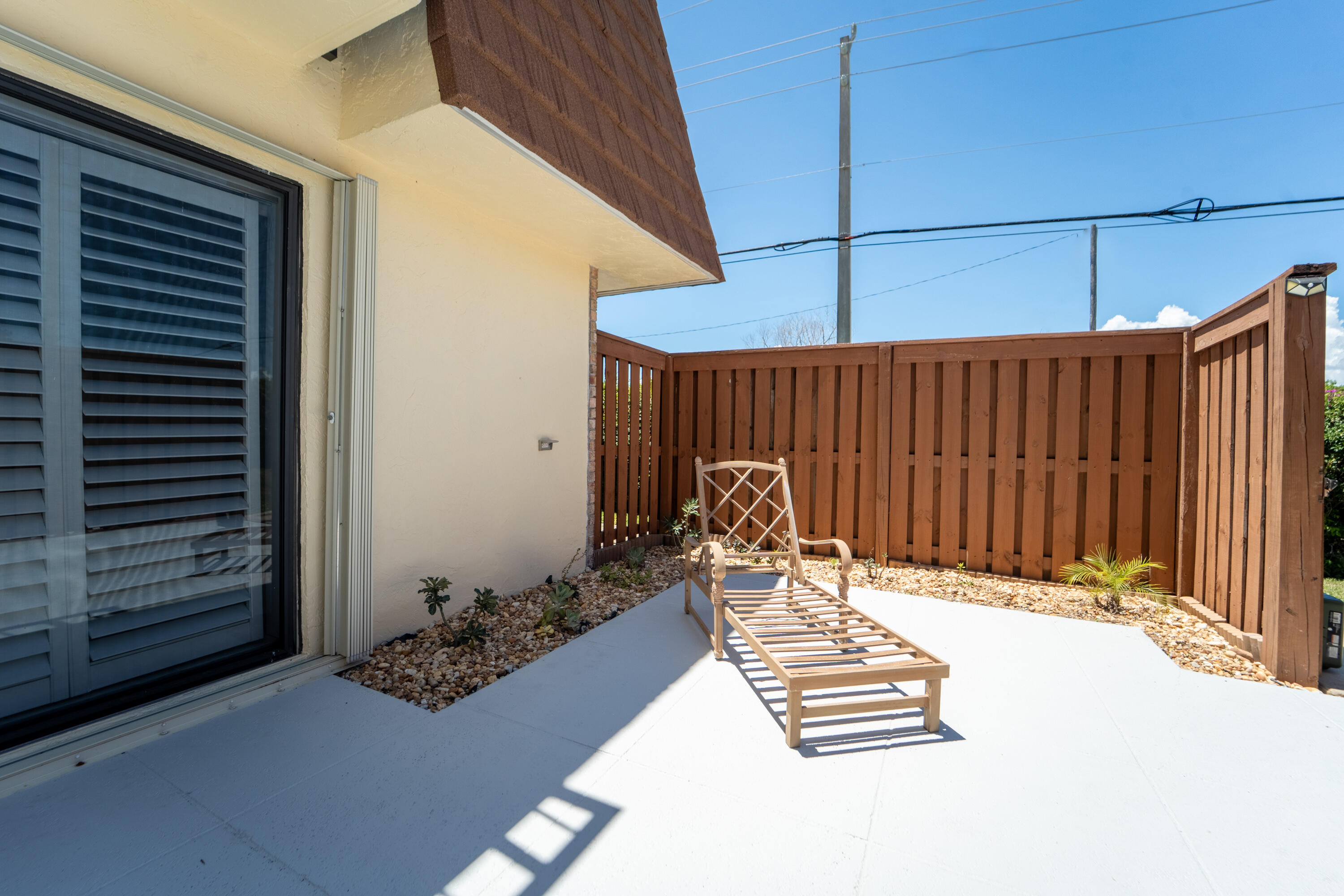 3900 County Line Road, Unit 11D Tequesta, FL 33469 - Photo 34 of 53 a view of a wooden floor in front of house