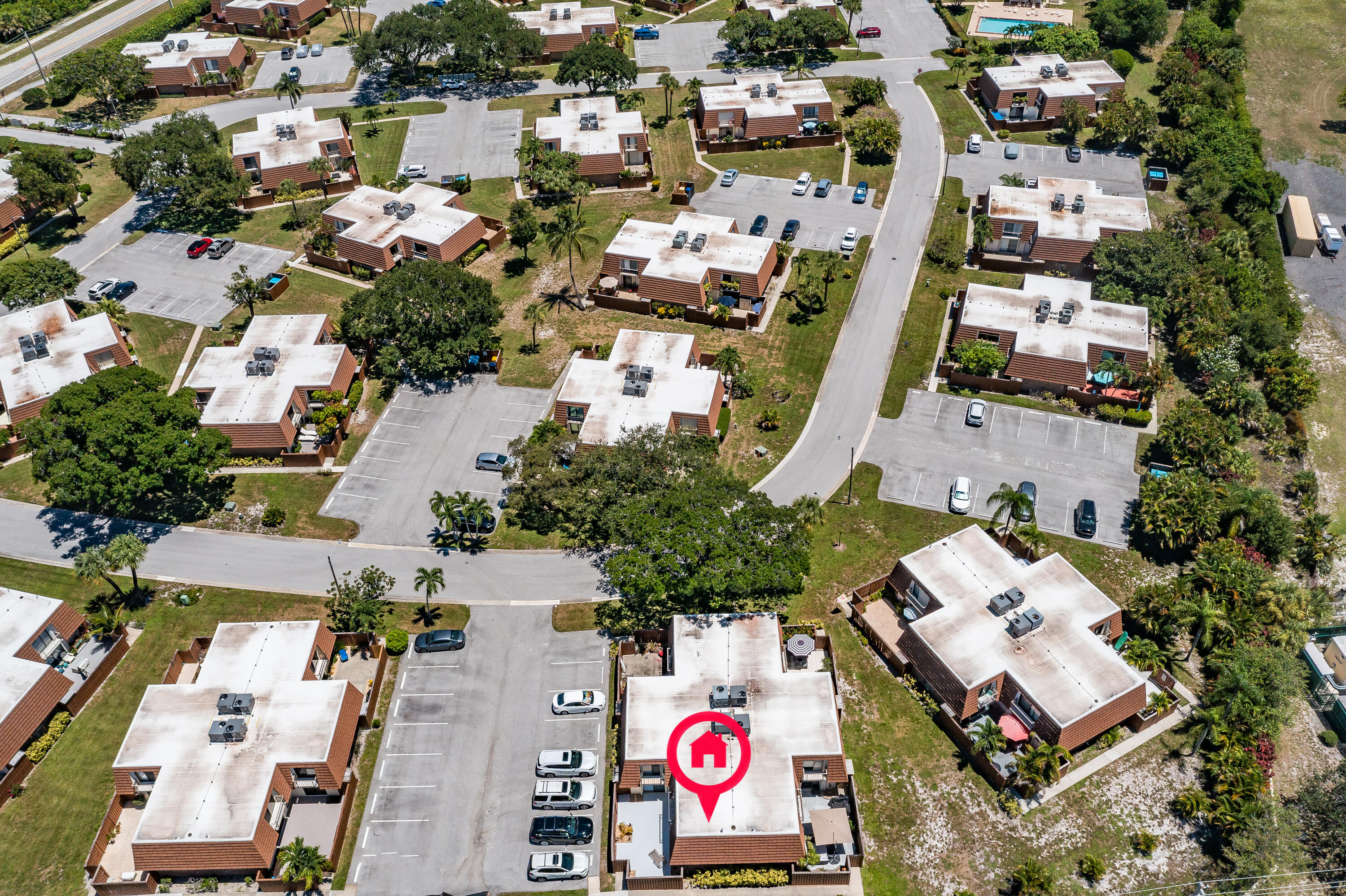 3900 County Line Road, Unit 11D Tequesta, FL 33469 - Photo 38 of 53 an aerial view of residential house with outdoor space and parking