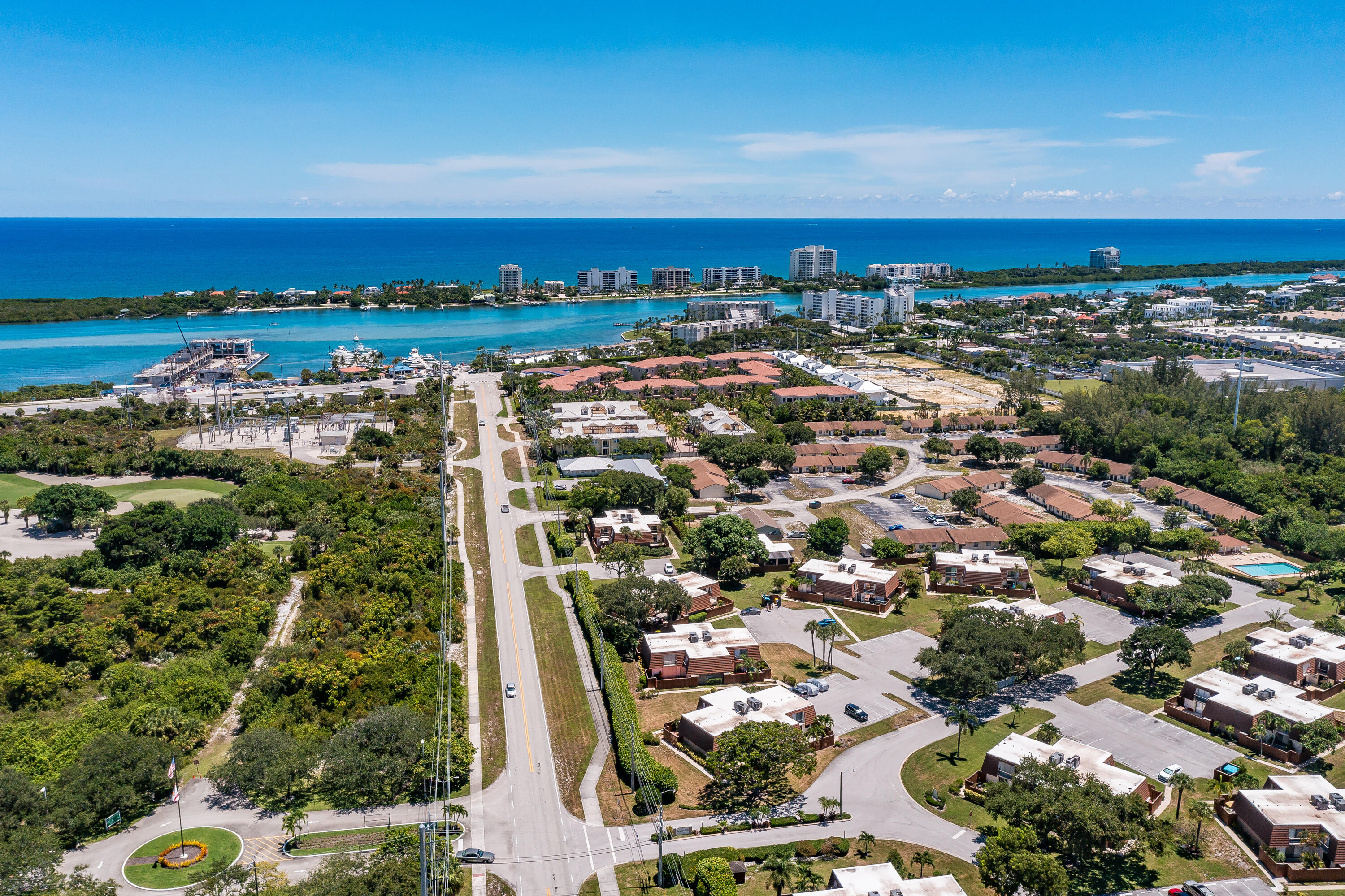 3900 County Line Road, Unit 11D Tequesta, FL 33469 - Photo 48 of 53 an aerial view of residential building and city