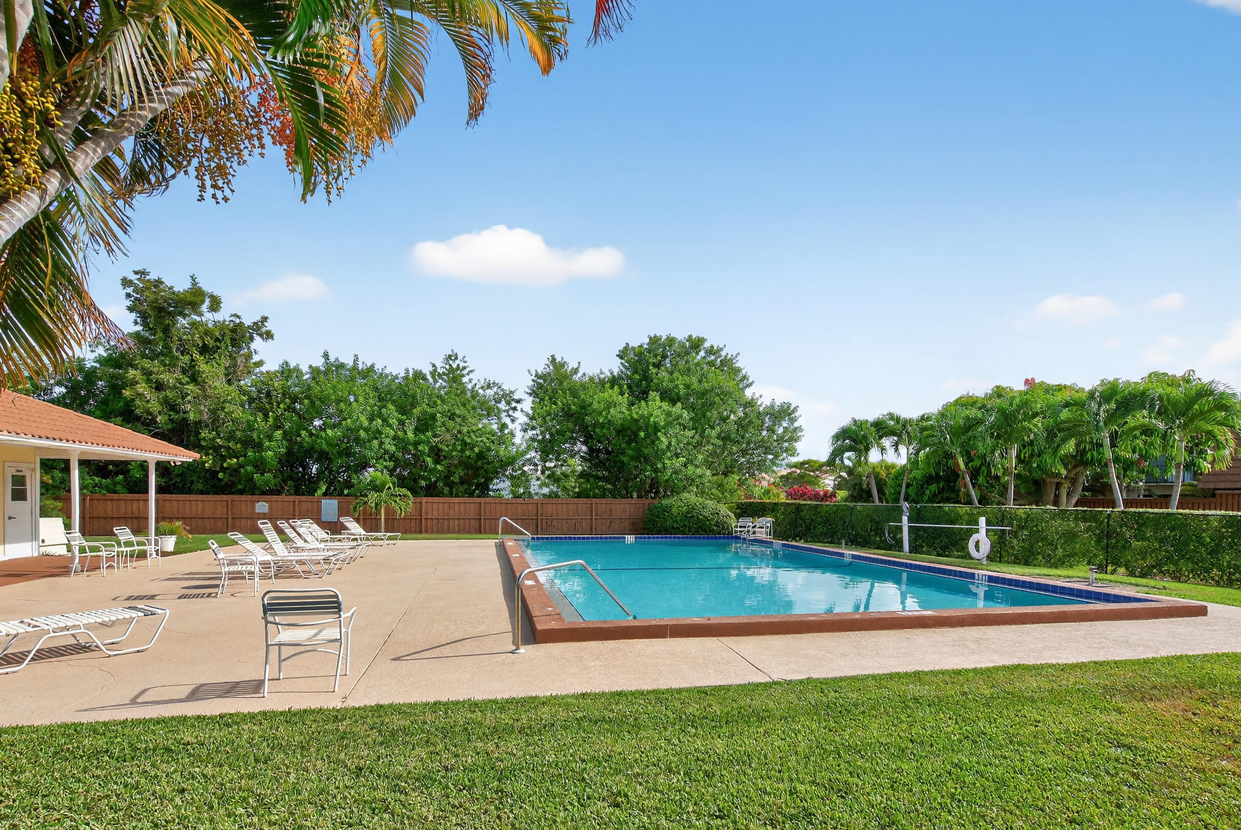 3900 County Line Road, Unit 11D Tequesta, FL 33469 - Photo 51 of 53 a view of a house with a yard