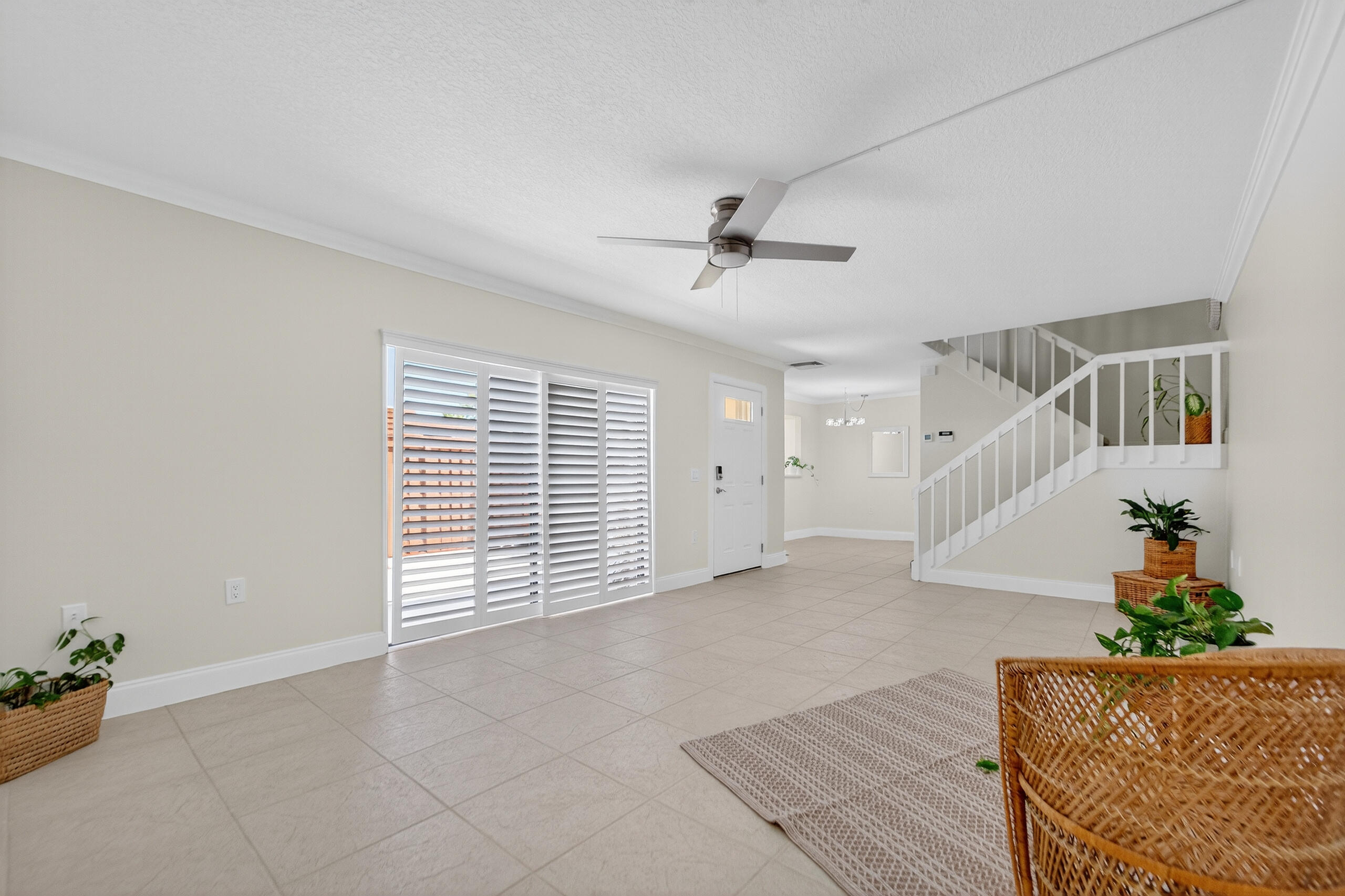 3900 County Line Road, Unit 11D Tequesta, FL 33469 - Photo 8 of 53 a view of an empty room with a window and wooden floor