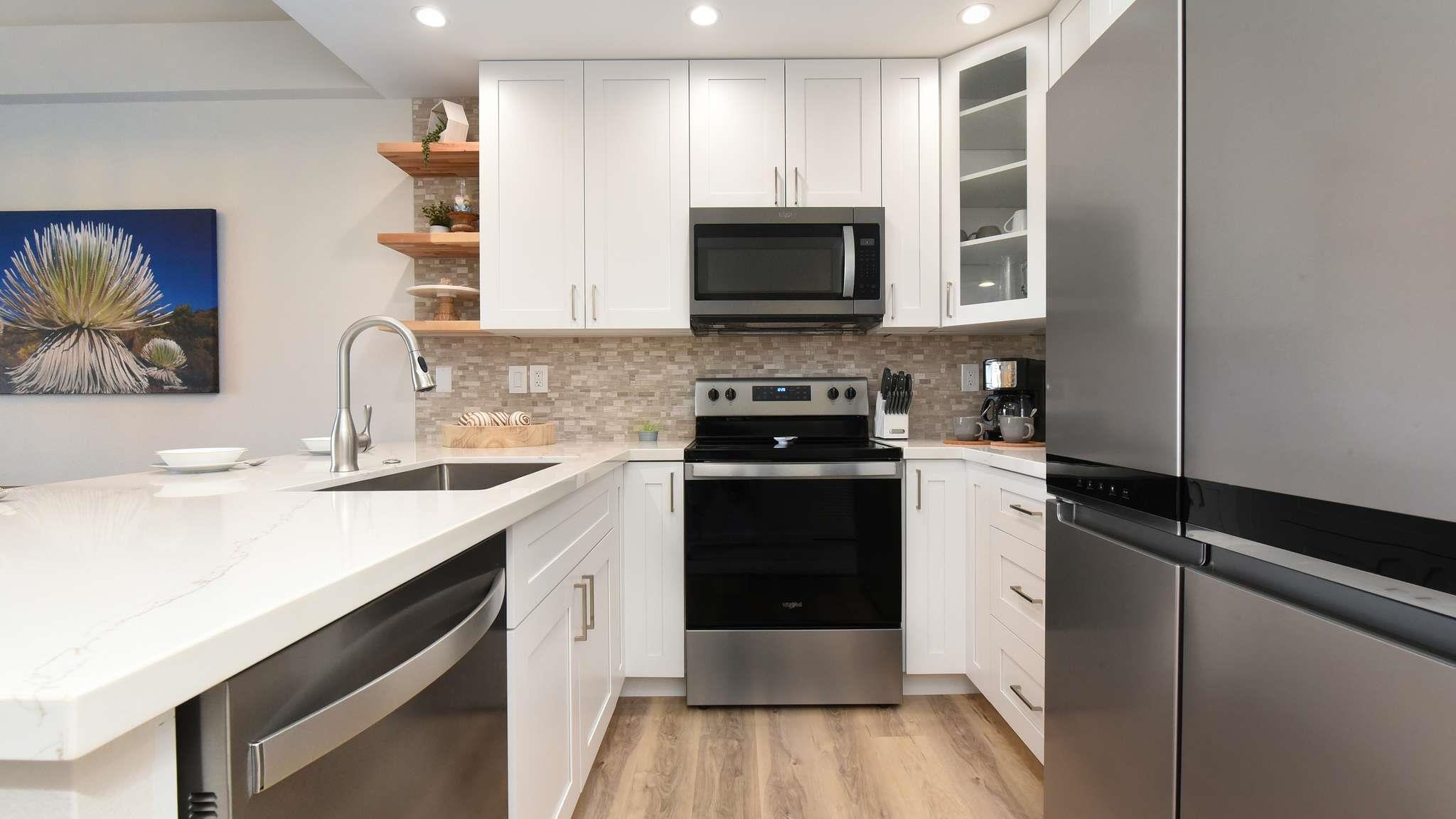 2777 South Kihei Road, Unit E202 Kihei, HI 96753 - Photo 12 of 37 a kitchen with a sink stove and microwave