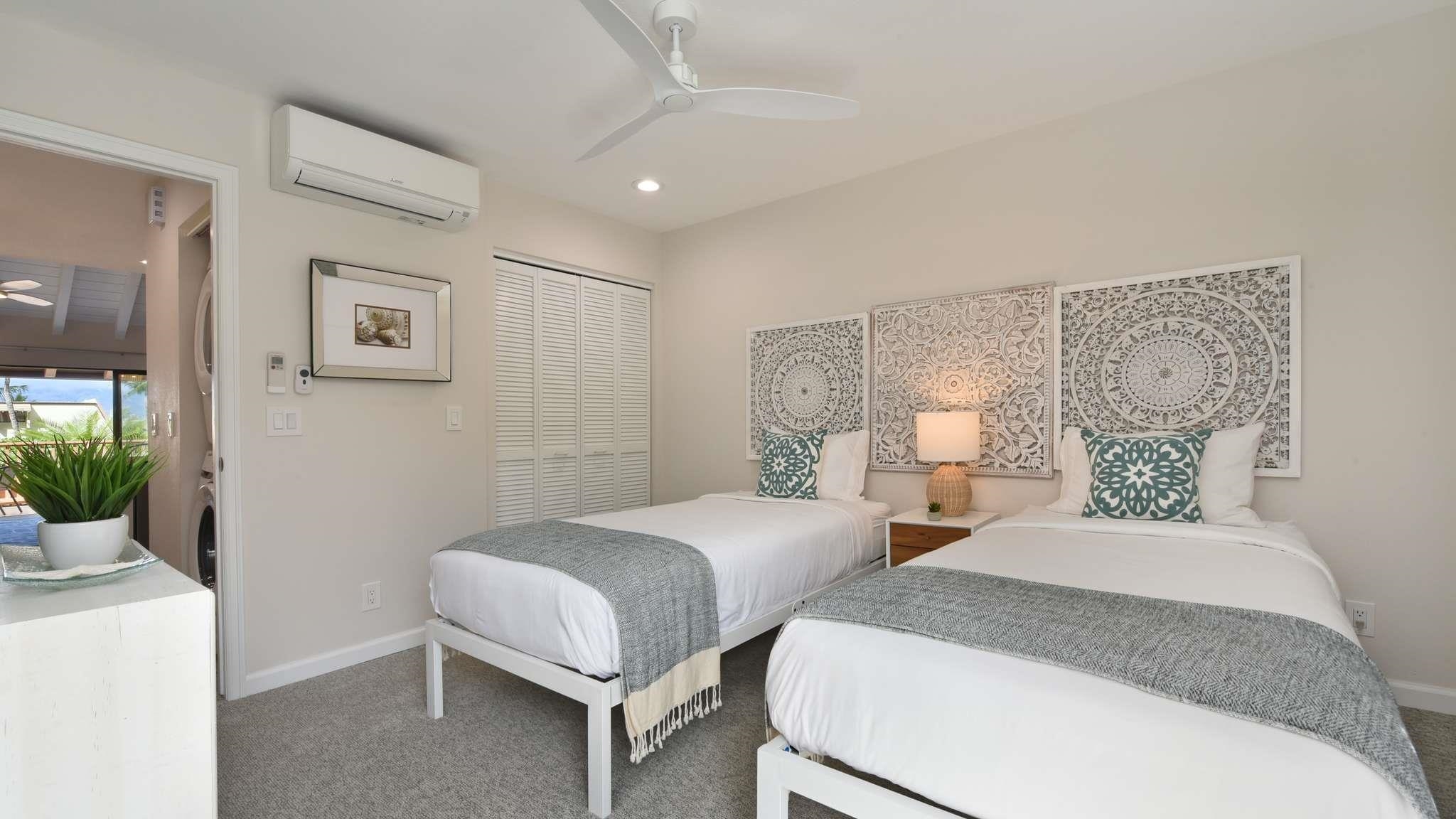 2777 South Kihei Road, Unit E202 Kihei, HI 96753 - Photo 15 of 37 a bedroom with two beds and a potted plant