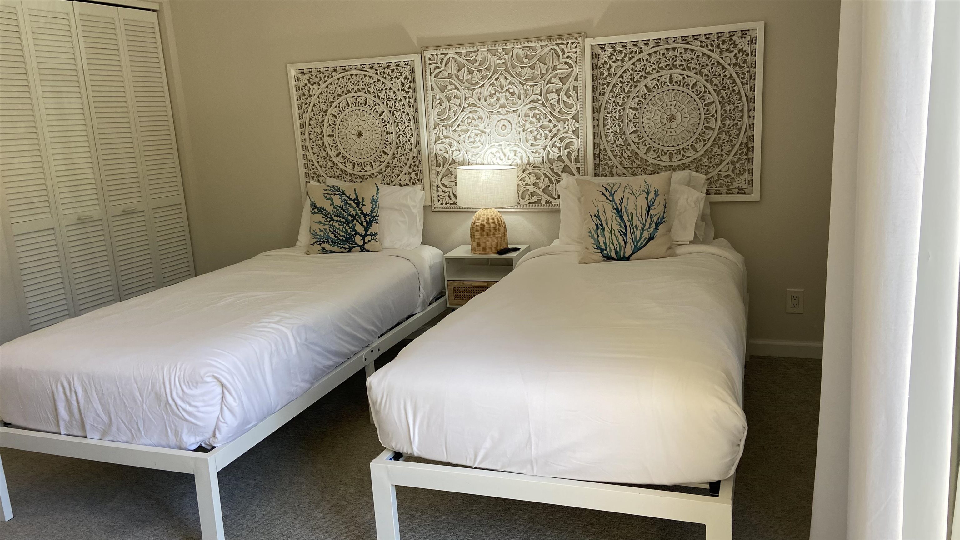 2777 South Kihei Road, Unit E202 Kihei, HI 96753 - Photo 17 of 37 a bedroom with a bed and a night stand