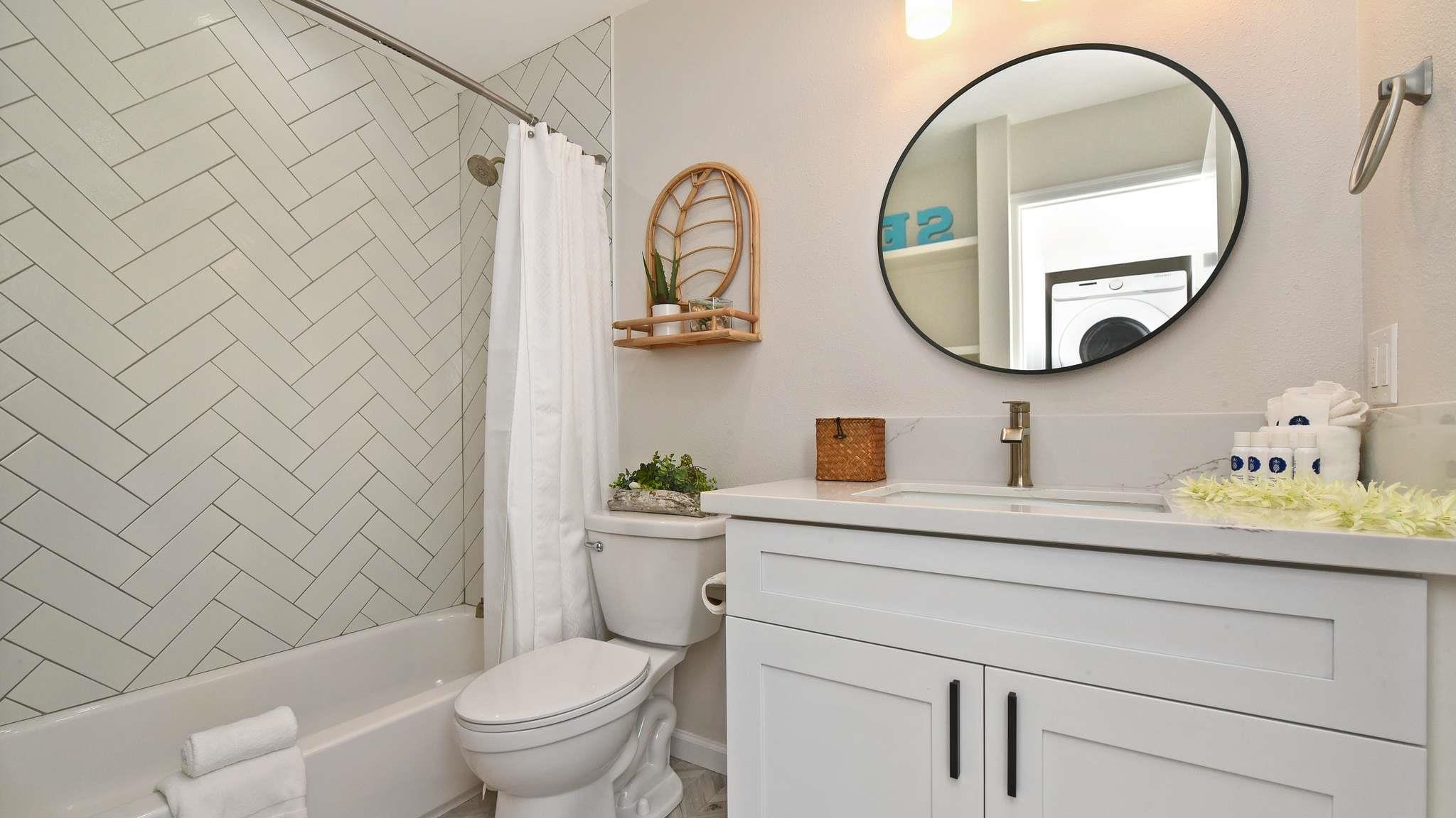 2777 South Kihei Road, Unit E202 Kihei, HI 96753 - Photo 21 of 37 a bathroom with a sink a toilet and a mirror