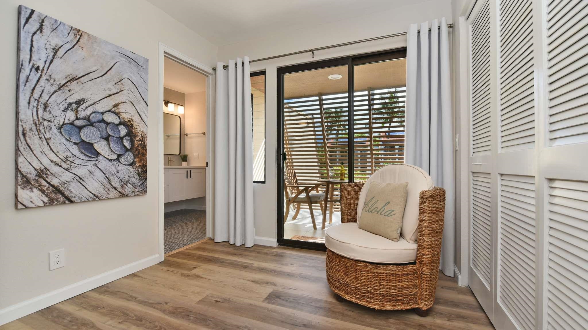 2777 South Kihei Road, Unit E202 Kihei, HI 96753 - Photo 26 of 37 a living room with furniture and a large window