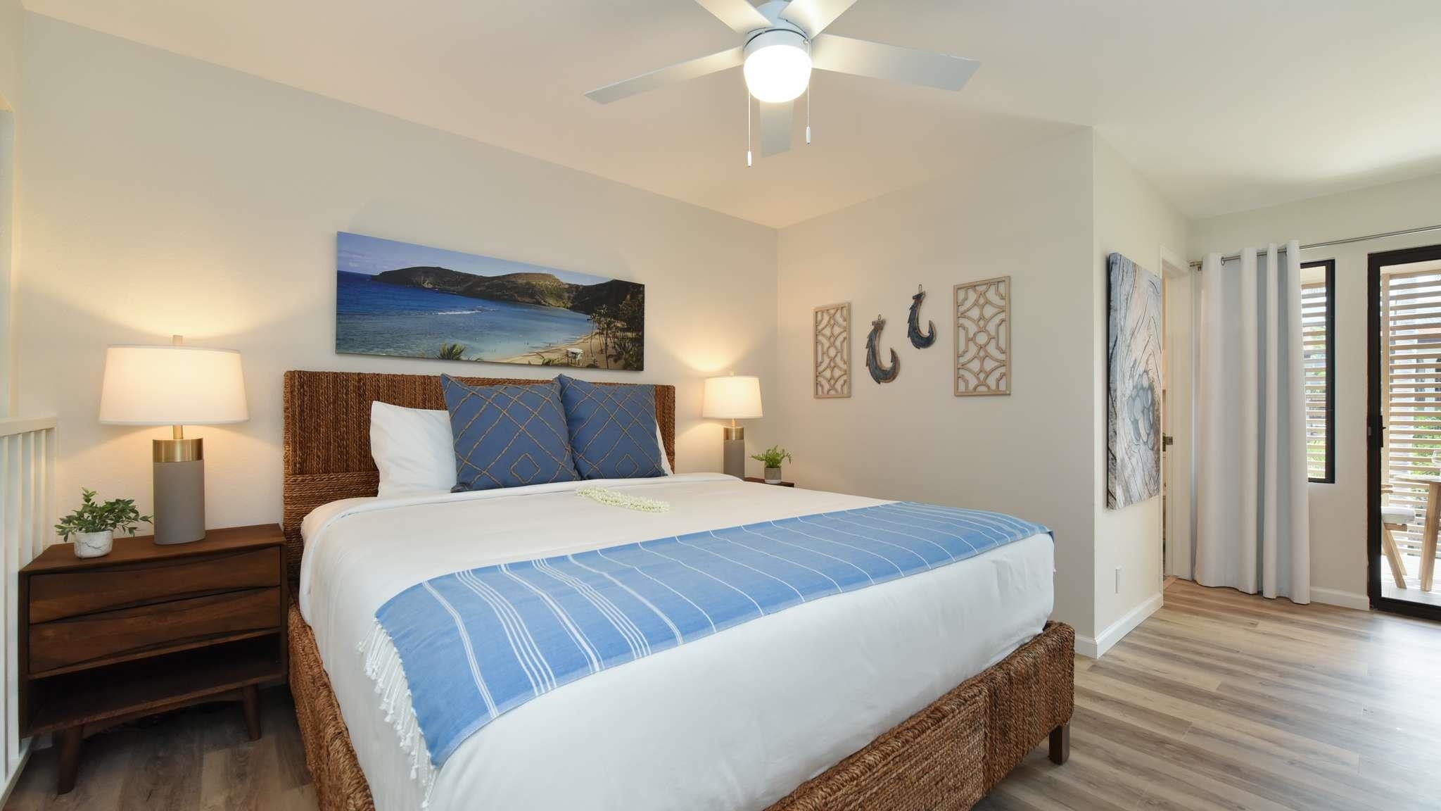 2777 South Kihei Road, Unit E202 Kihei, HI 96753 - Photo 29 of 37 a bedroom with a bed and wooden floor