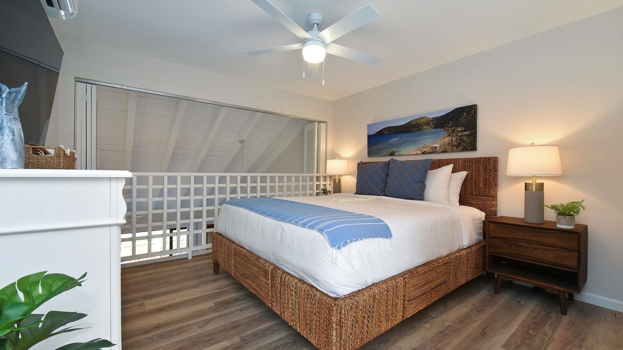 2777 South Kihei Road, Unit E202 Kihei, HI 96753 - Photo 30 of 37 a bedroom with a bed and a refrigerator