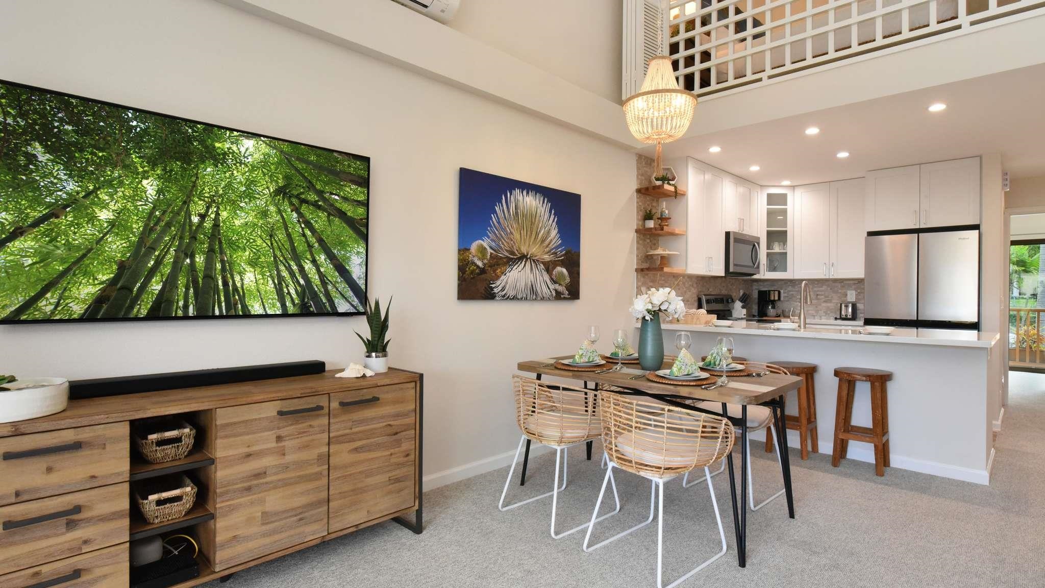 2777 South Kihei Road, Unit E202 Kihei, HI 96753 - Photo 8 of 37 a kitchen with a cabinets a sink and a stove top oven with wooden floor