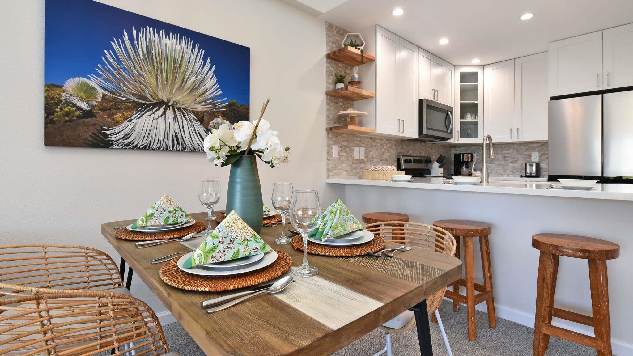 2777 South Kihei Road, Unit E202 Kihei, HI 96753 - Photo 10 of 37 a dining room with furniture and window