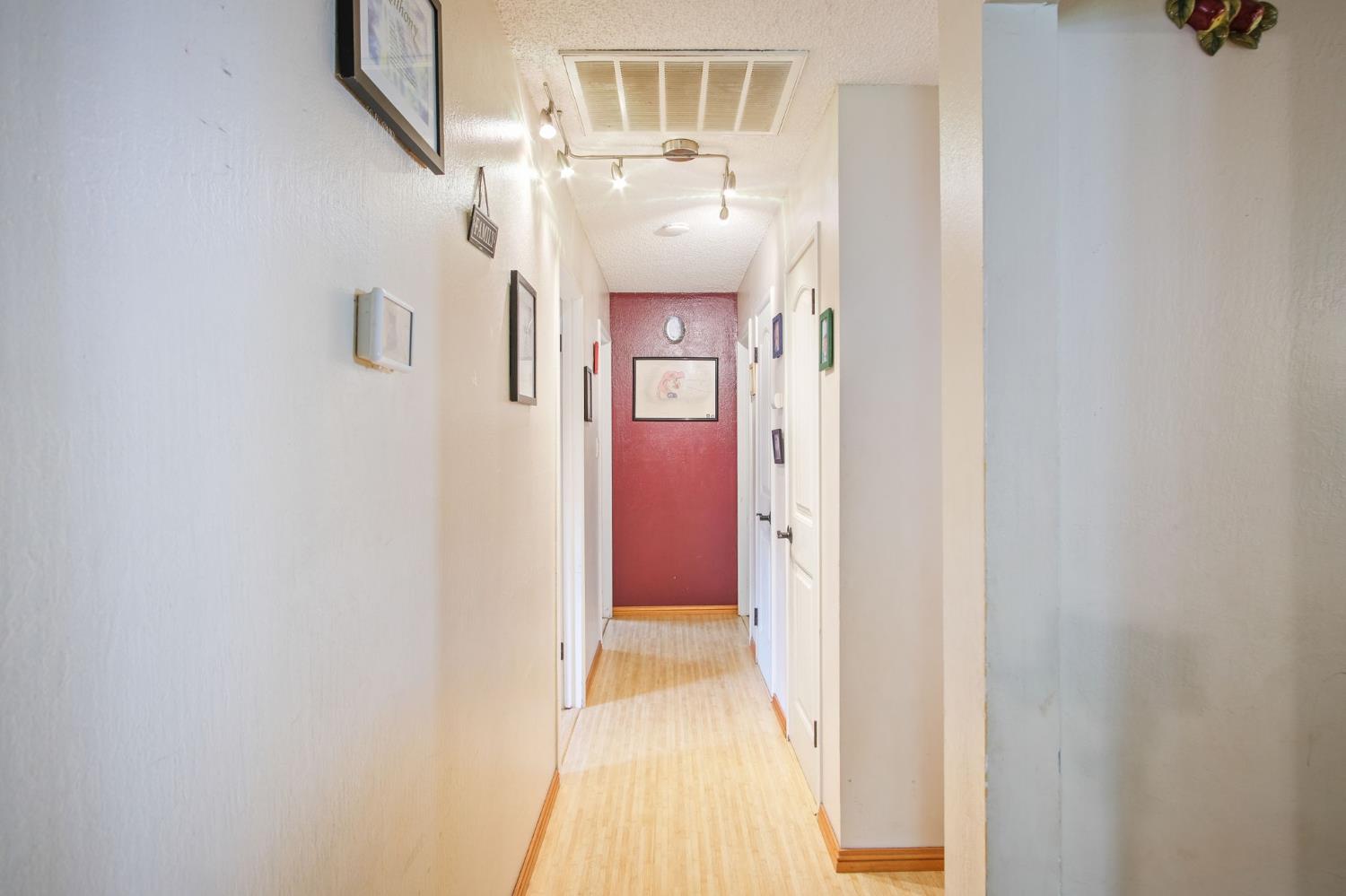 3221 Dublin Avenue Merced, CA 95340 - Photo 13 of 22 a view of a hallway with a dining room