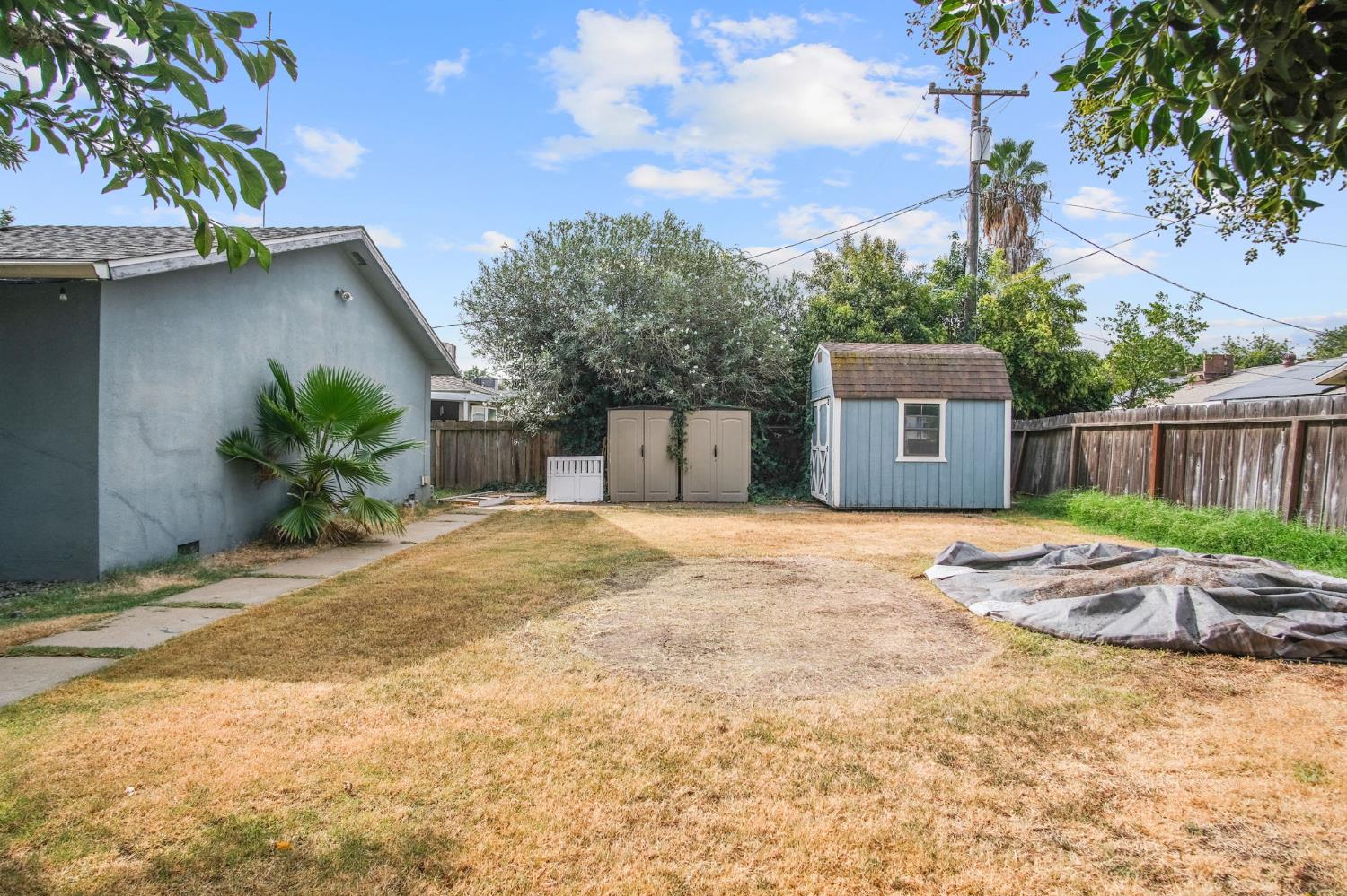 3221 Dublin Avenue Merced, CA 95340 - Photo 20 of 22 a house with a bench in front of it