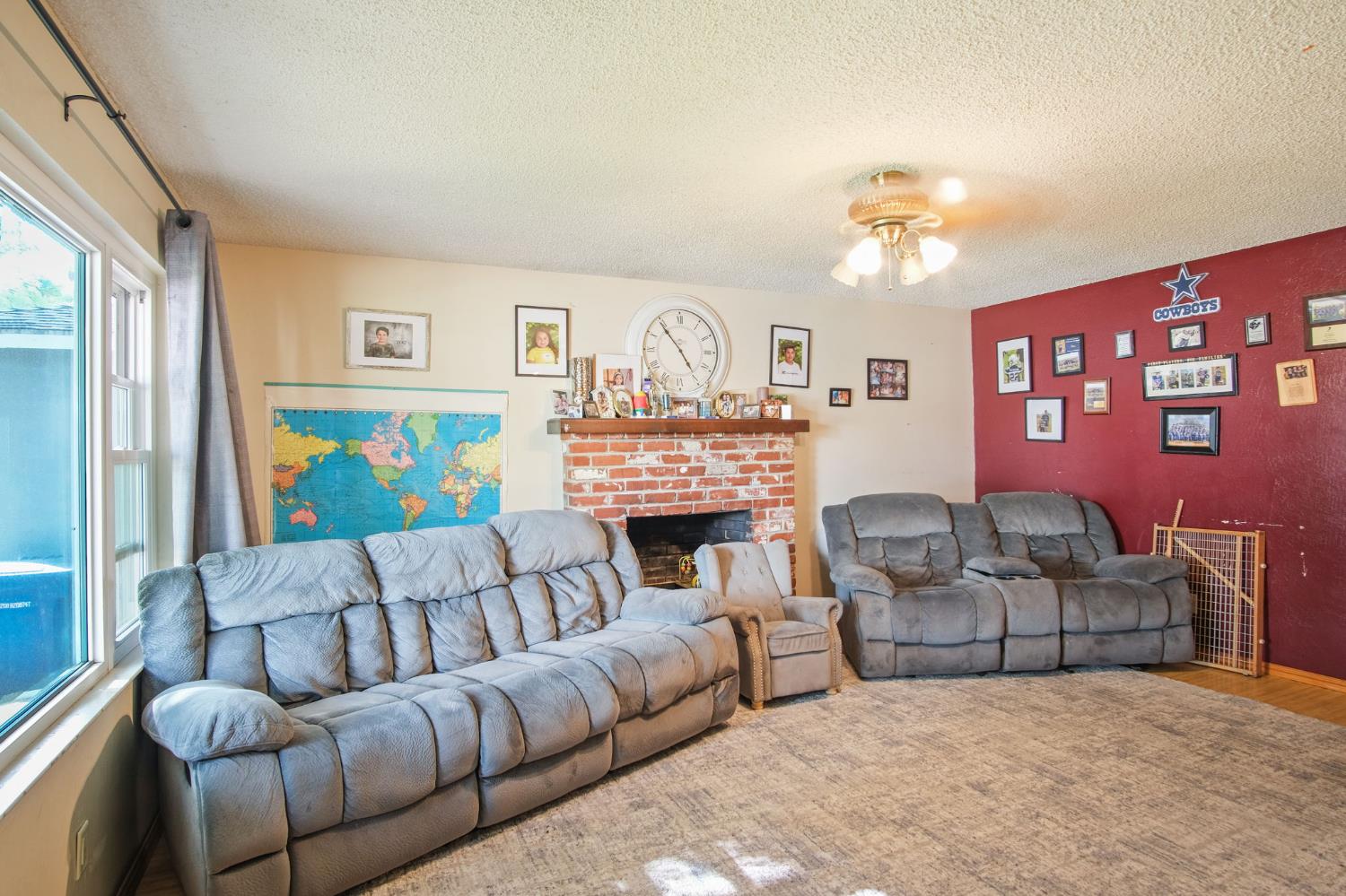 3221 Dublin Avenue Merced, CA 95340 - Photo 5 of 22 a living room with furniture fireplace and a window