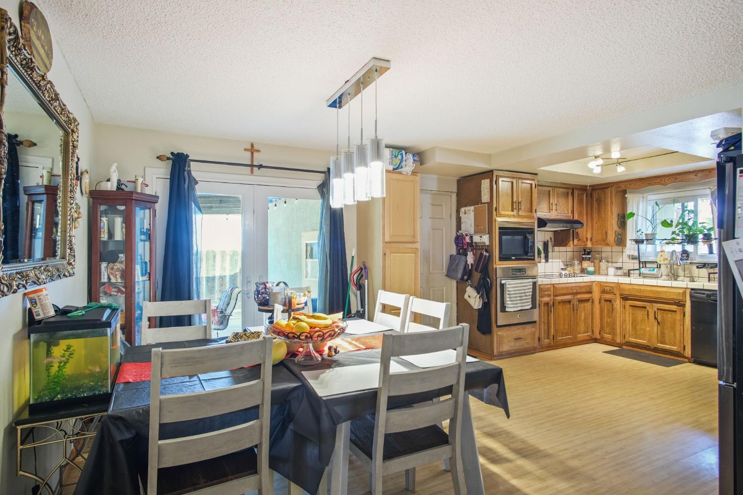 3221 Dublin Avenue Merced, CA 95340 - Photo 7 of 22 a view of a dining room with furniture window and outside view