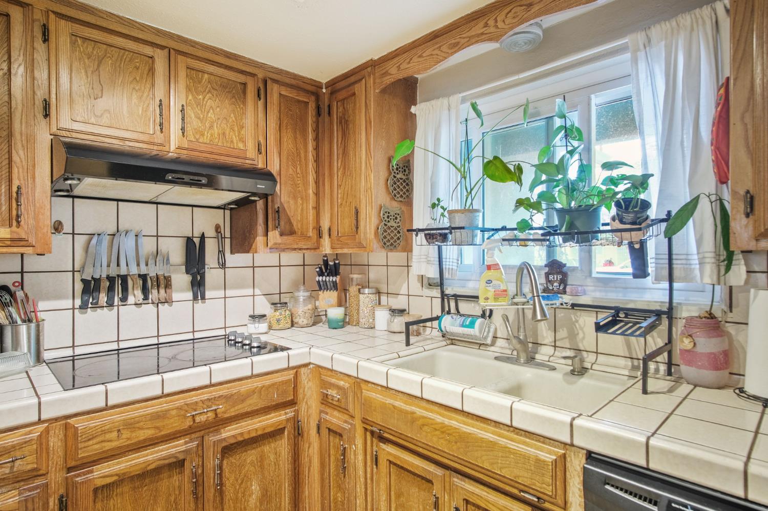 3221 Dublin Avenue Merced, CA 95340 - Photo 10 of 22 a kitchen with stainless steel appliances granite countertop a sink and a stove