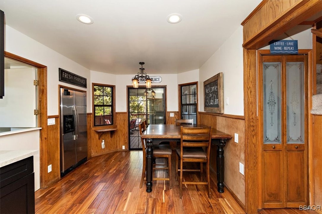 667 Talmadge Road Big Bear Lake, CA 92315 - Photo 17 of 41 a view of a dining room with furniture and wooden floor