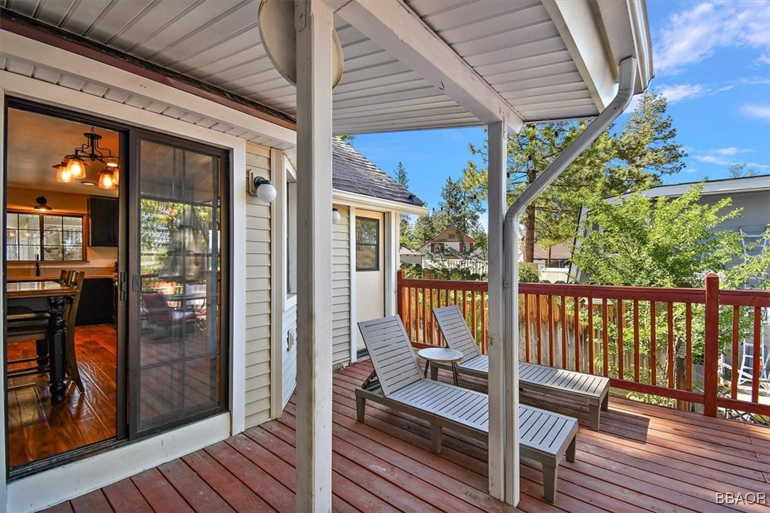 667 Talmadge Road Big Bear Lake, CA 92315 - Photo 33 of 41 a view of a balcony with chairs and wooden floor