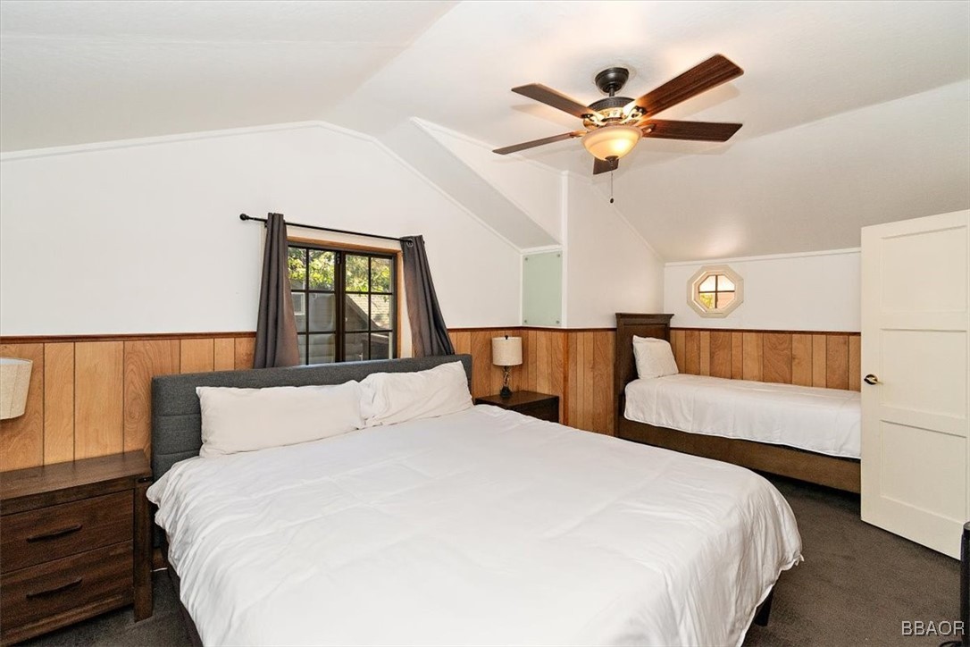 667 Talmadge Road Big Bear Lake, CA 92315 - Photo 34 of 41 a bedroom with a large bed and a ceiling fan