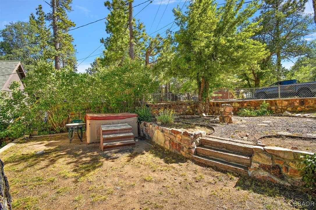 667 Talmadge Road Big Bear Lake, CA 92315 - Photo 6 of 41 a view of a wooden deck with a bench