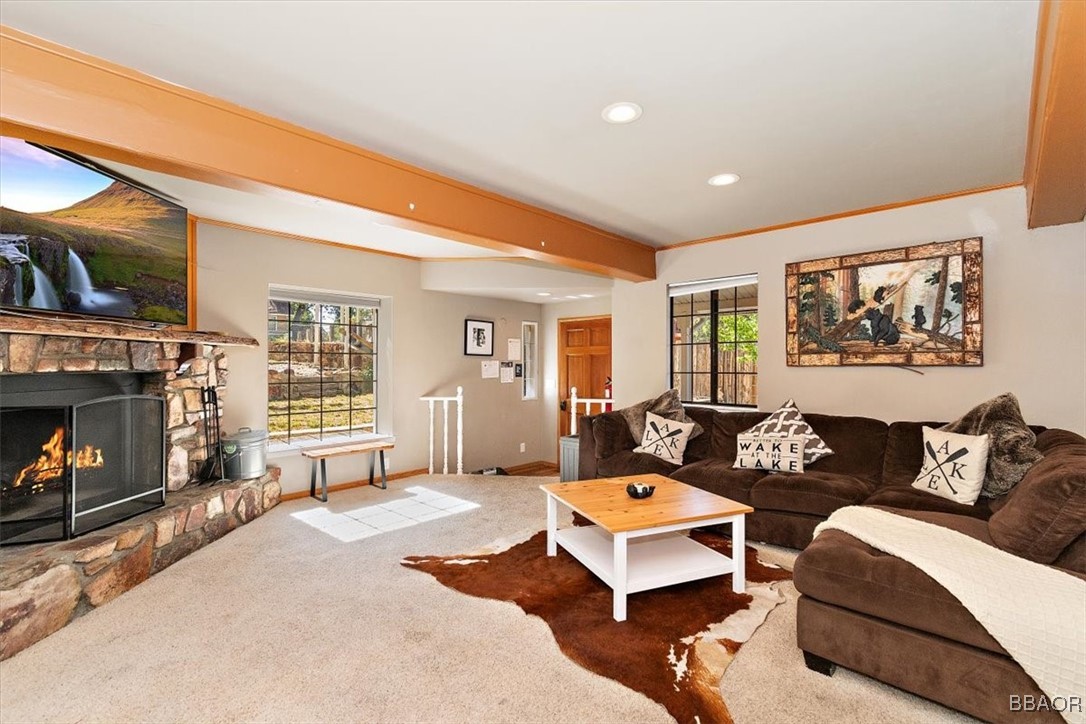 667 Talmadge Road Big Bear Lake, CA 92315 - Photo 10 of 41 a living room with furniture and a fireplace