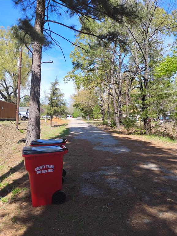 295 James Fannin Road Honey Grove, TX 75446 - Photo 23 of 30 a sign that is sitting on the side of a road