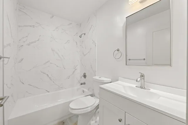 a view of a porch with a wooden door and deck