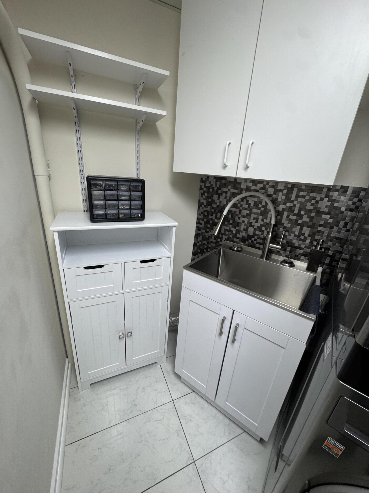 333 Lake Avenue, Unit 806 Racine, WI 53403 - Photo 31 of 62 5F_LST 806_Laundry Room Sink_Feb 7