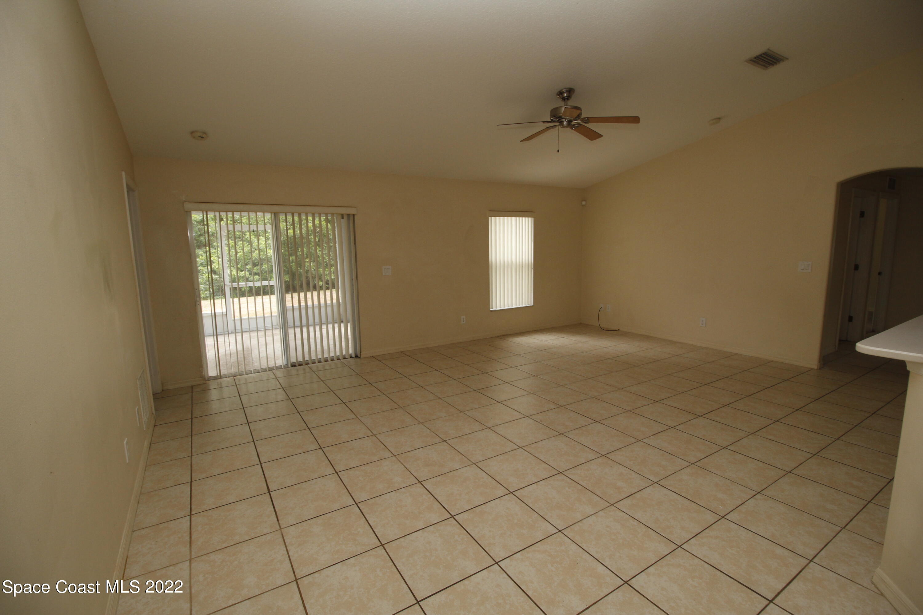 846 Walpole Road Southwest Palm Bay, FL 32908 - Photo 3 of 15 a view of an empty room and window