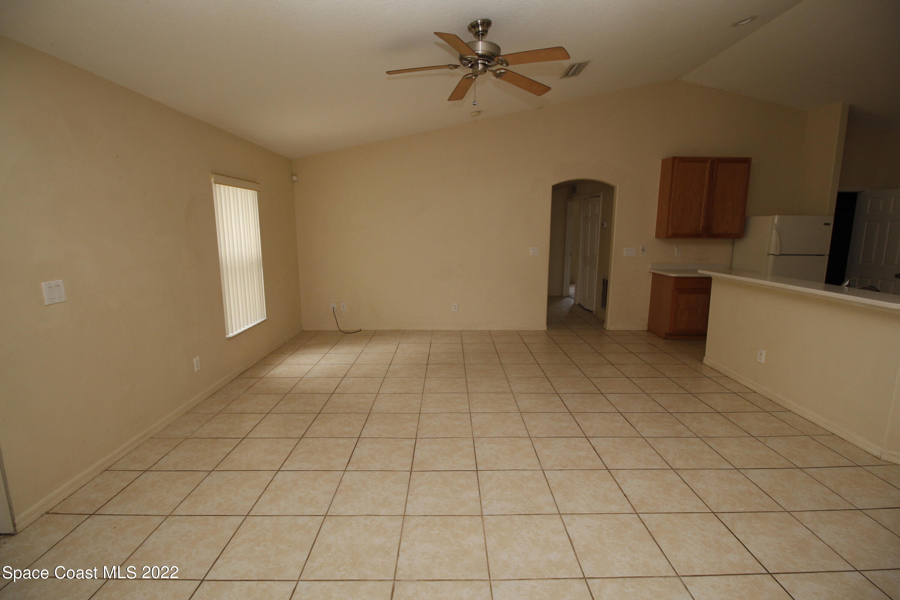 846 Walpole Road Southwest Palm Bay, FL 32908 - Photo 4 of 15 a view of an empty room and a window
