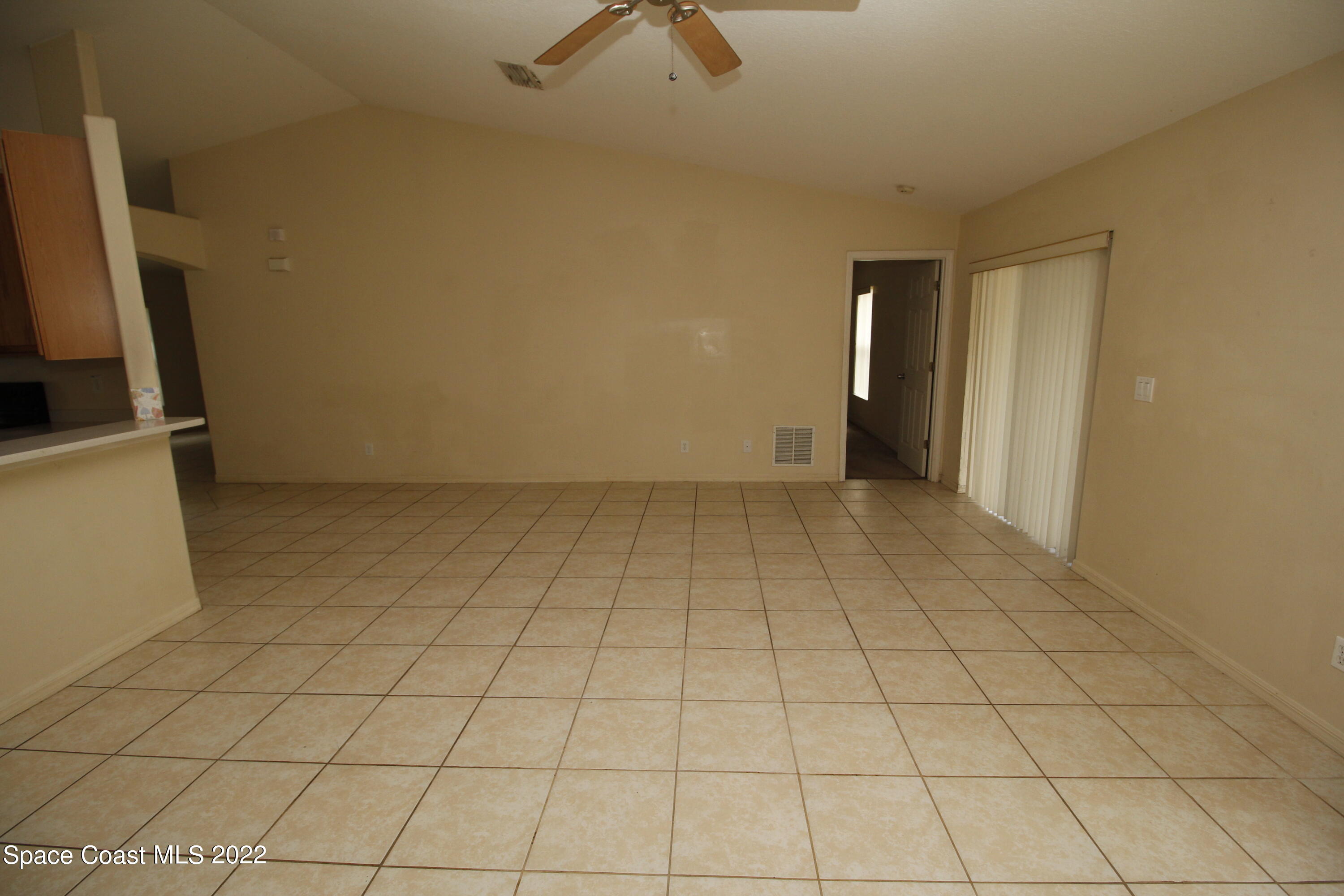846 Walpole Road Southwest Palm Bay, FL 32908 - Photo 5 of 15 a view of an empty room and a window