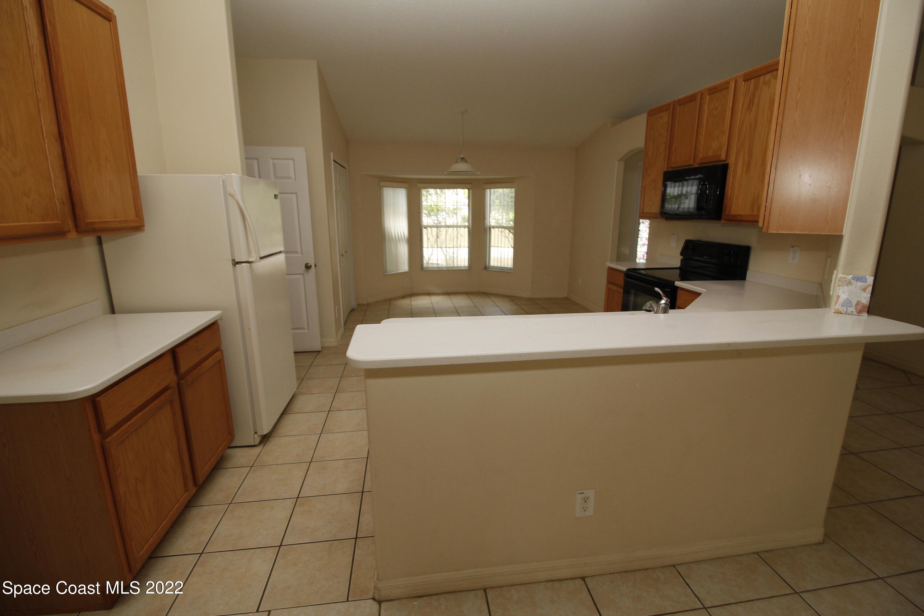 846 Walpole Road Southwest Palm Bay, FL 32908 - Photo 6 of 15 a bathroom with a sink a toilet and mirror