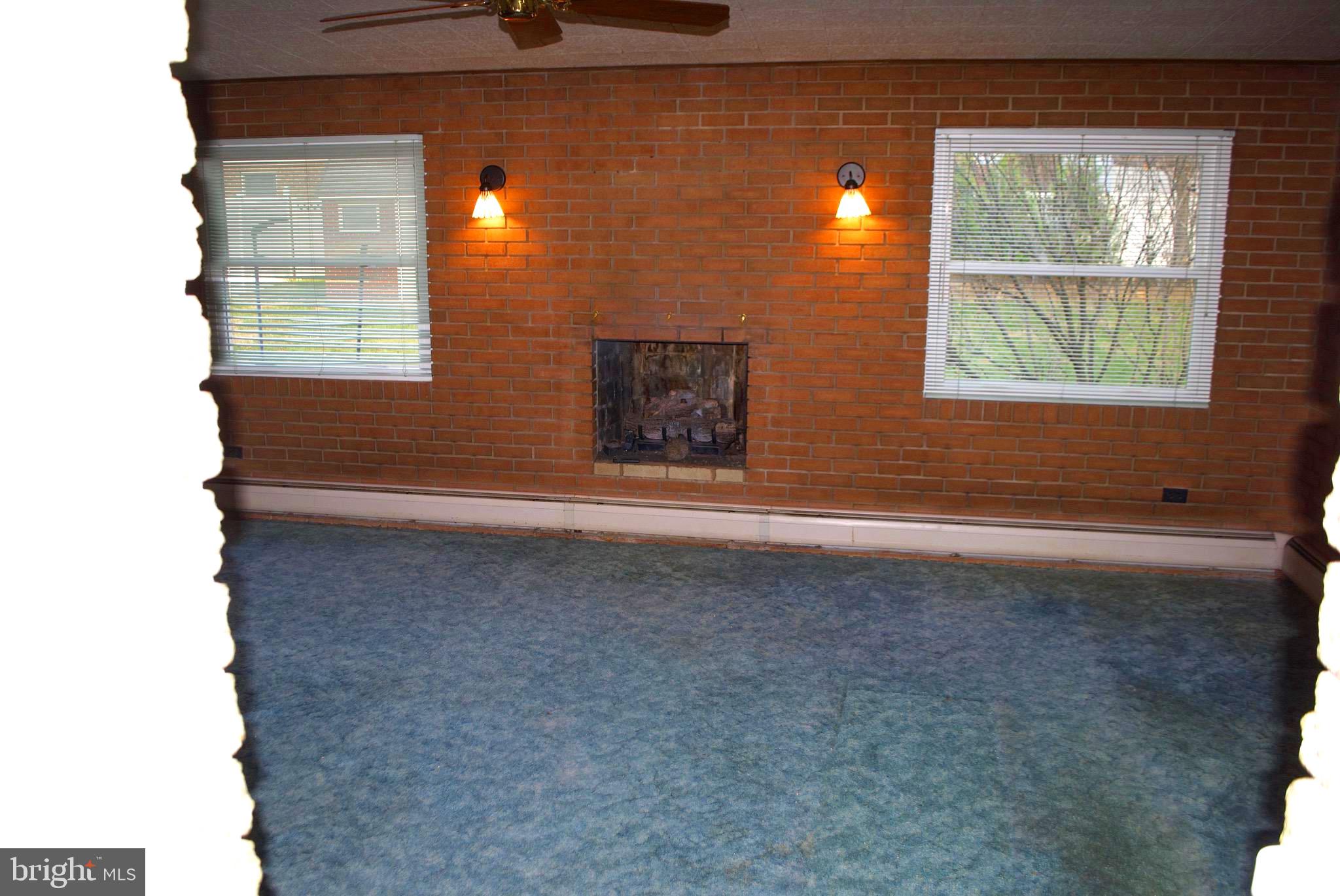 10809 Breewood Road Silver Spring, MD 20901 - Photo 2 of 24 Den with fireplace
