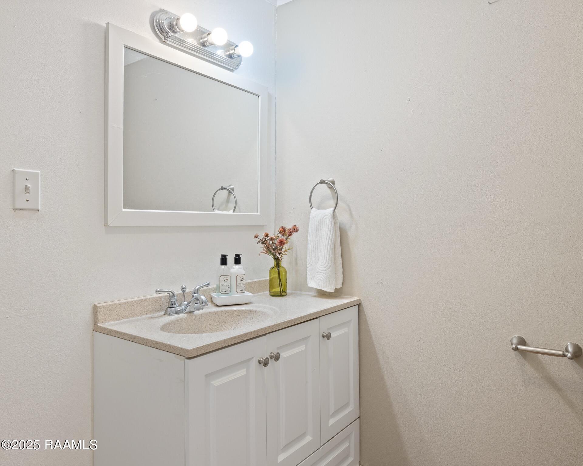 1002 Alexander Road St. Martinville, LA 70582 - Photo 11 of 17 guest bathroom vanity