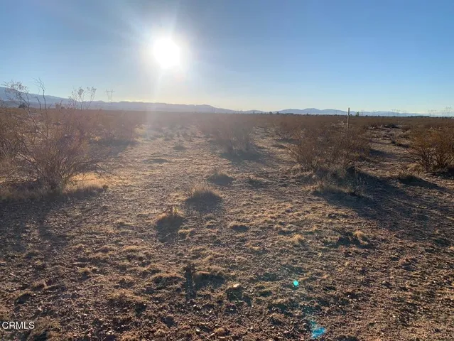 an aerial view of house with mountain view