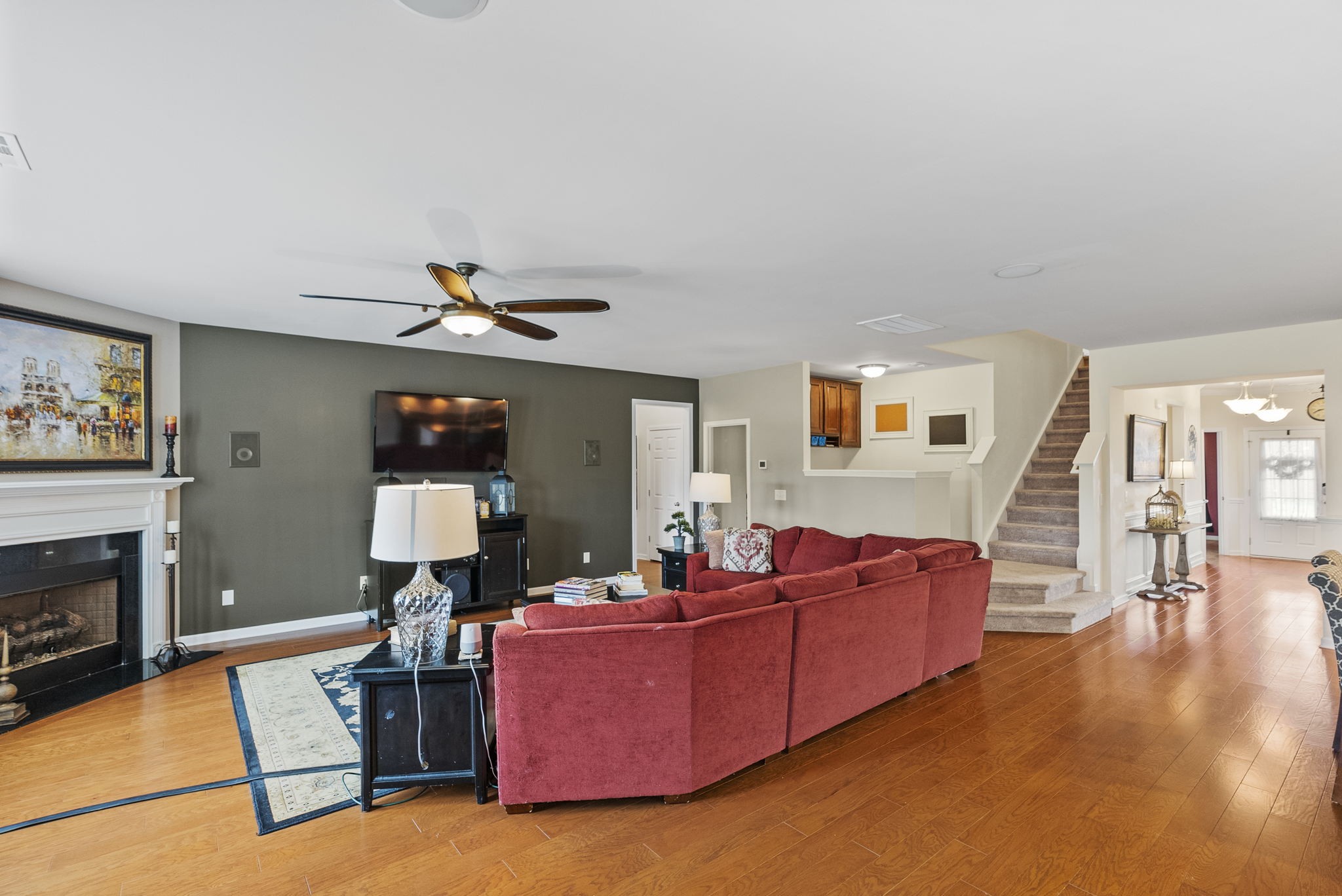 1064 Addington Road Hendersonville, TN 37075 - Photo 17 of 55 a living room with furniture a flat screen tv and a fireplace
