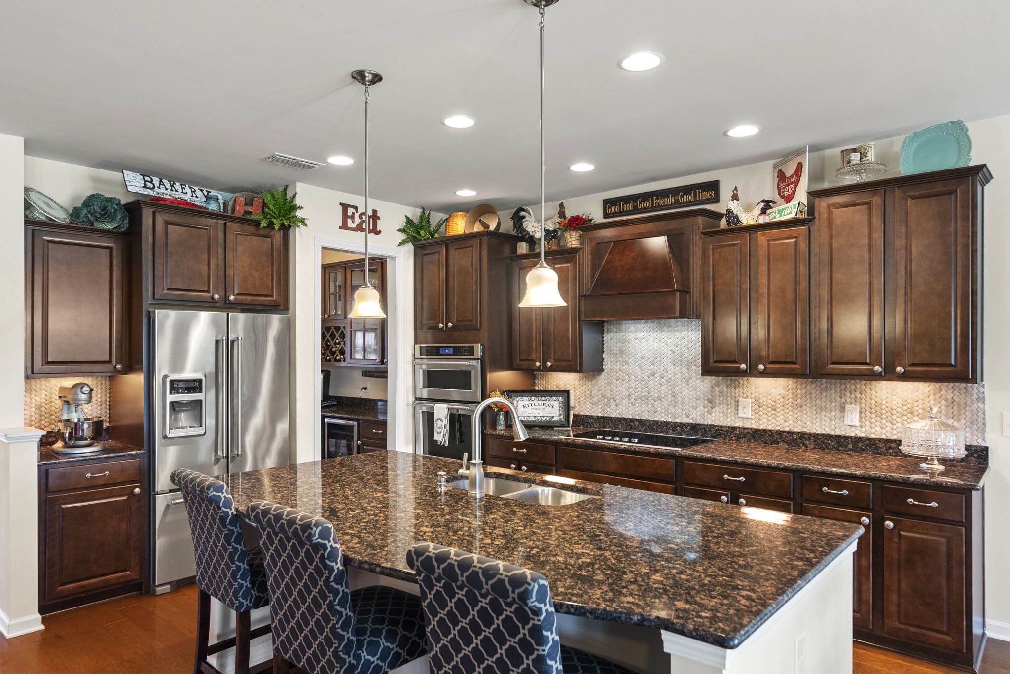 1064 Addington Road Hendersonville, TN 37075 - Photo 24 of 55 a kitchen with a table chairs refrigerator and microwave