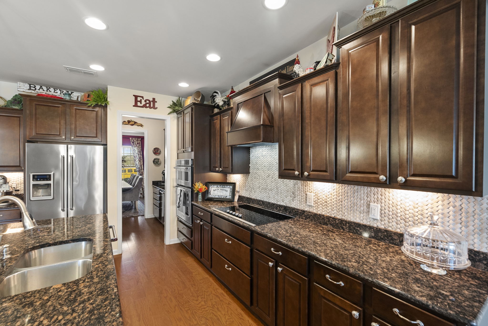 1064 Addington Road Hendersonville, TN 37075 - Photo 26 of 55 a kitchen with stainless steel appliances granite countertop a refrigerator a sink and wooden cabinets